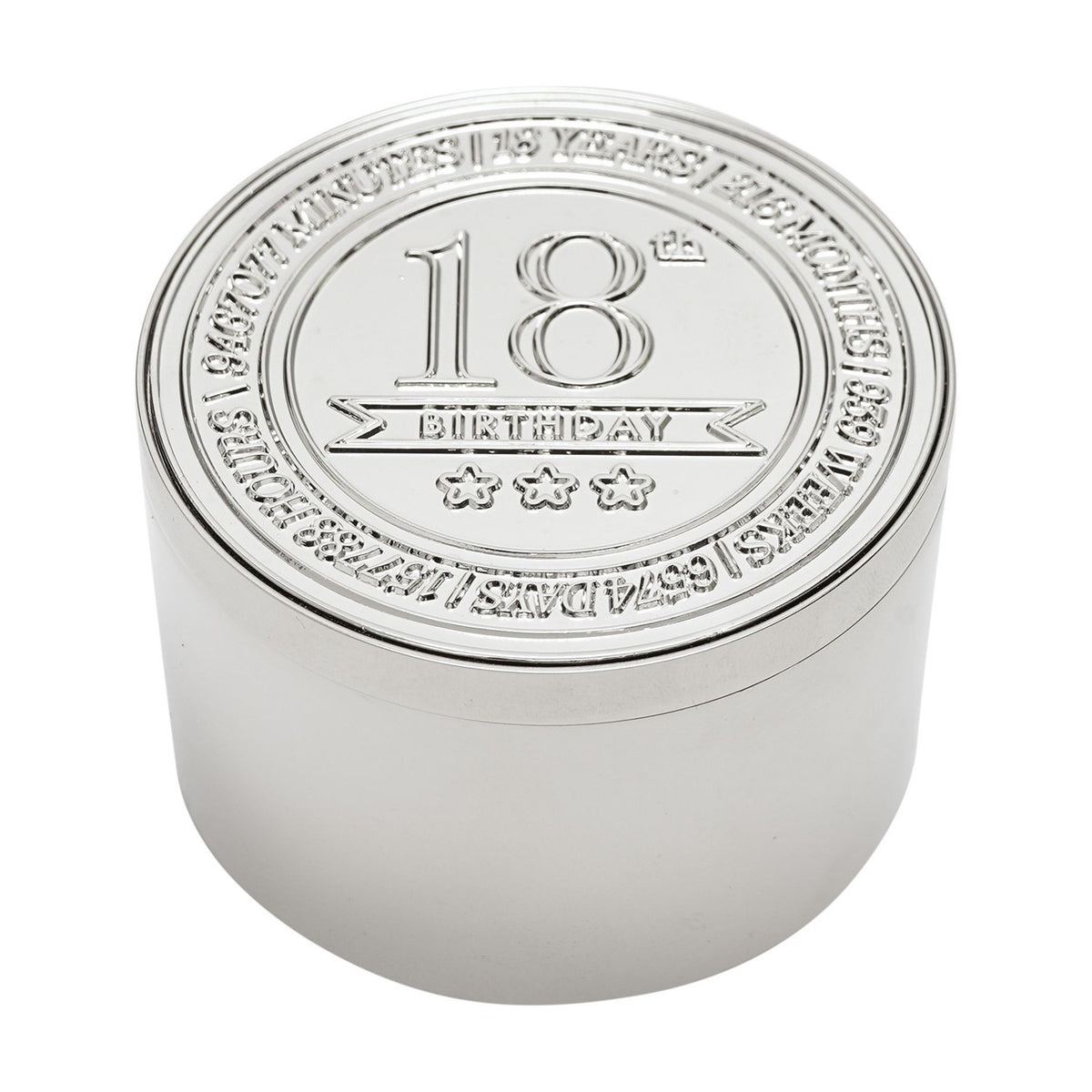 Round silver metal trinket box with embossed lid reading "18th Birthday" above three stars, encircled by engraved text, on a plain white background.