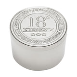 Round silver metal trinket box with embossed lid reading "18th Birthday" above three stars, encircled by engraved text, on a plain white background.