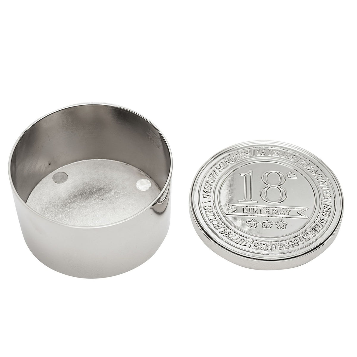 Round silver metal trinket box, open to show the empty interior, with lid beside it embossed "18th Birthday" and stars within a decorative ringed border, on a white background.