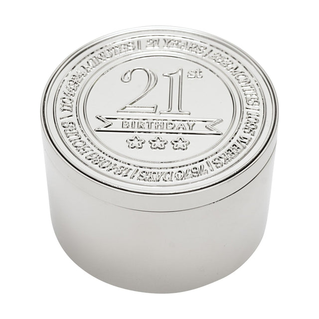 Round silver metal trinket box with embossed lid reading "21st Birthday" above three stars, bordered by engraved time units, shown on a white background.