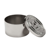 Round silver metal trinket box with lid propped beside its open cylindrical base, lid embossed with "50" birthday design and surrounding text, on a plain white background.
