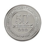 Round silver-coloured metal trinket box lid embossed with "50th BIRTHDAY" banner, three stars, and encircling text counting 50 years in months, weeks, days, hours and minutes, on a white background.