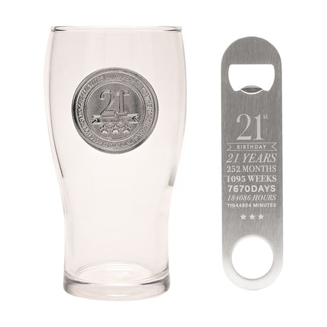 Clear glass pint beer glass with raised silver 21st badge and three stars, paired with a matching stainless steel bottle opener engraved with 21st Birthday milestones, on a white background.