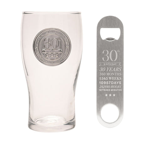 Clear tulip-shaped pint glass with a silver "30th Birthday" badge and star detail, paired with a matching stainless steel bottle opener engraved with milestone stats, on a white background.