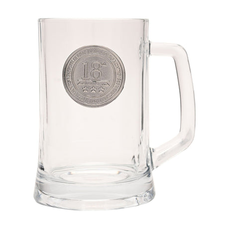 Clear glass tankard beer mug with a squared handle and a round silver-toned badge reading "18th" with stars and banner detail, shown on a plain white background.