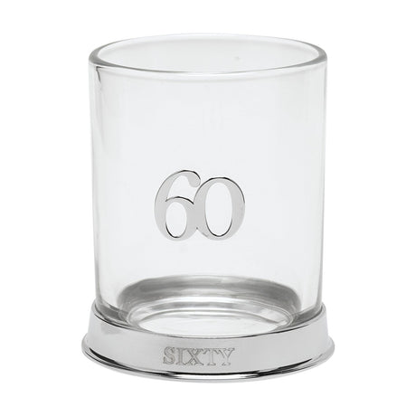 Clear glass whisky tumbler with a raised silver 3D "60" on the side and a silver base engraved "SIXTY", shown on a plain white background.