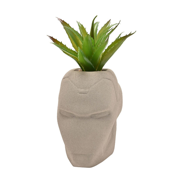 Iron Man helmet-shaped metal planter in matt cement grey with raised facial detailing, planted with a spiky green faux plant, shown on a plain white background.