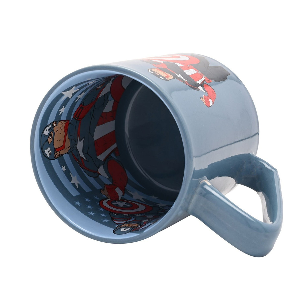 Blue porcelain Avengers Captain America mug tipped on its side, showing the navy interior decal of Captain America with his shield against a white background.
