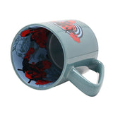 Green porcelain Deadpool mug tipped on its side, showing the pale blue interior decal of the character in action poses and the glossy green handle, on a plain white background.