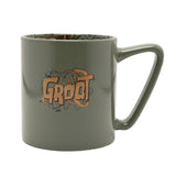 Green porcelain mug with "I AM GROOT" wood-grain lettering and vine design, glossy finish, visible inside decal pattern, on a plain white background.