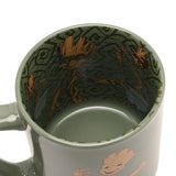 Green porcelain Avengers Groot mug, 500ml, shown from above with an inside decal of dancing Groot figures in wood-brown tones against a spiral-patterned green interior.
