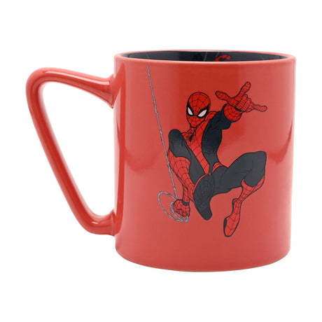 Red porcelain mug with a printed Spider-Man figure swinging on a web line, black curved handle, and a dark navy city-scene decal visible inside, shown on a white background.