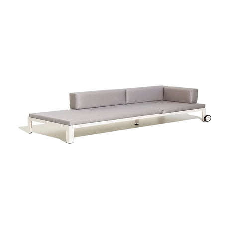 Nak Aluminium Day and Night Sun Lounger with grey cushions, white powder-coated frame, side wheel, and low profile, shown on a plain white background.