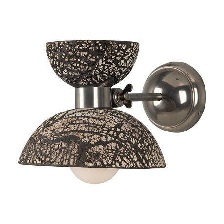 Nakaii Ceramic Wall Light in black clay with a white crackled pattern, featuring a small cup atop a wider dome, mounted on a satin silver arm and round wall plate against a plain white background.