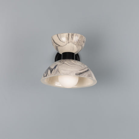 Nakaii Ceramic Wall Light in marbled grey and white, with a small upper bowl and wider domed shade on a black metal arm, exposed bulb visible, shown on a plain grey background.