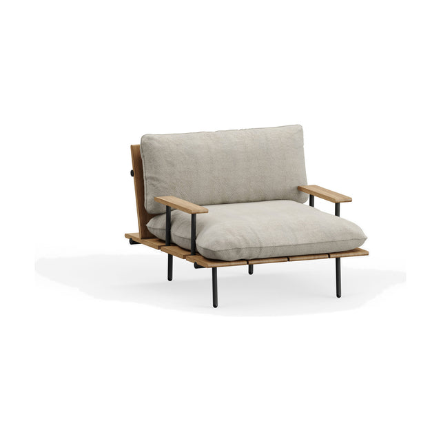 Nami garden armchair with iroko wood slatted seat and back, black aluminium legs and arm supports, dressed with beige cushions on a plain white background.