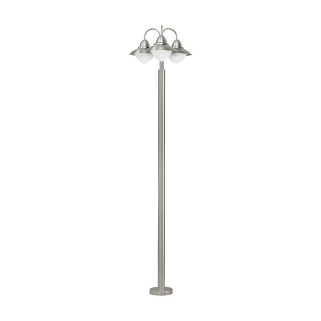 Nasvanne outdoor floor lamp in stainless steel, tall slim column on a round base with three curved arms, each with a metal hood over an opal glass globe, on a plain white background.
