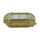 Horatio Oval Bulkhead Light in raw brass with clear ribbed glass diffuser and crossed brass cage bars, IP64 nautical-style wall light on a white background.