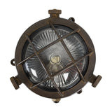 Mini Compass Guard round bulkhead light in antique brass, solid brass crossed-bar guard over domed ribbed glass with rim thumb screws, IP44, on a white background.