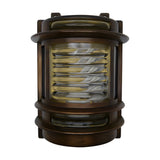Cargo Outdoor Wall Light in antique brass, a solid brass bulkhead fitting with curved ribbed glass panel, tiered brass bands, and side glazing, shown on a plain white background.