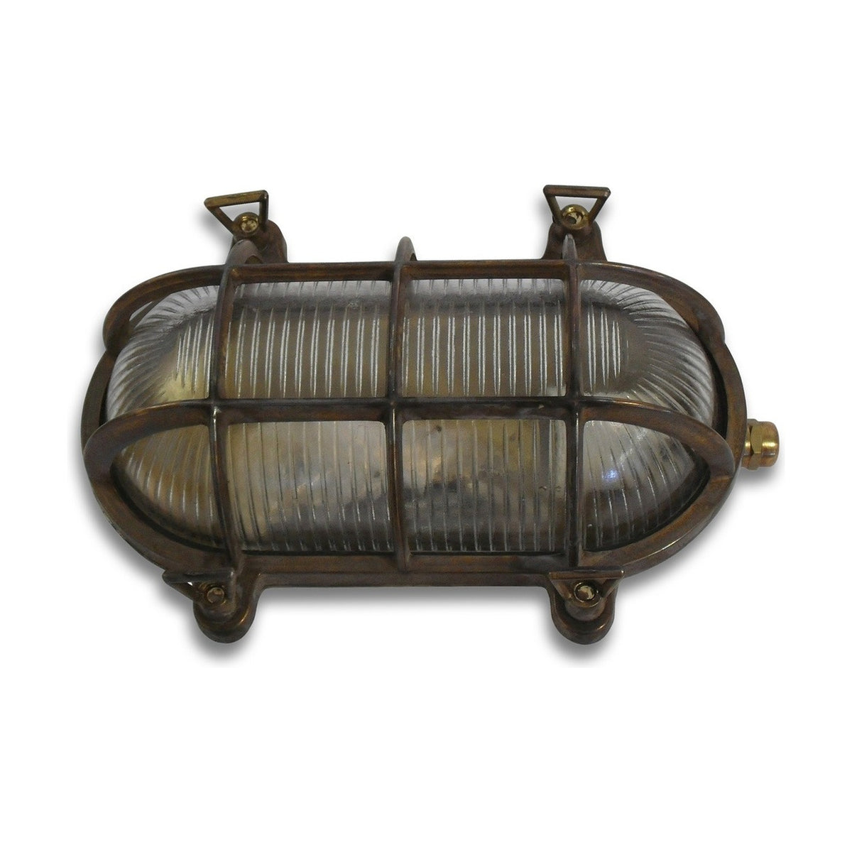 Horatio Oval Bulkhead Light in antique brass finish, IP64 outdoor wall light with ribbed glass diffuser, brass cage, corner lugs and gland, shown on a white background.