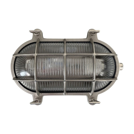 Horatio Oval Bulkhead Light in satin nickel, showing a ribbed glass cover behind a crossed bar cage with corner mounting lugs, IP64 rated, on a plain white background.