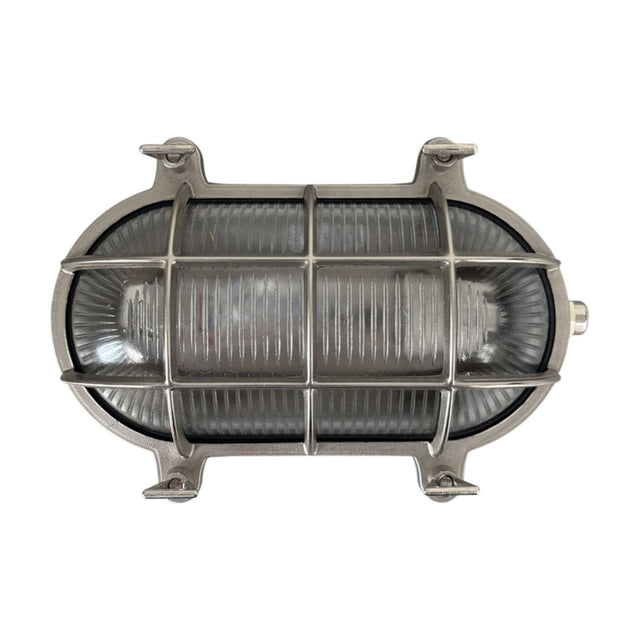 Horatio Oval Bulkhead Light in satin nickel, showing a ribbed glass cover behind a crossed bar cage with corner mounting lugs, IP64 rated, on a plain white background.