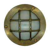 Marina Guard Circular Bulkhead Light in antique brass, round frame with cross-bar cage guard over frosted glass diffuser, fixed by three visible screws, shown on a plain white background.
