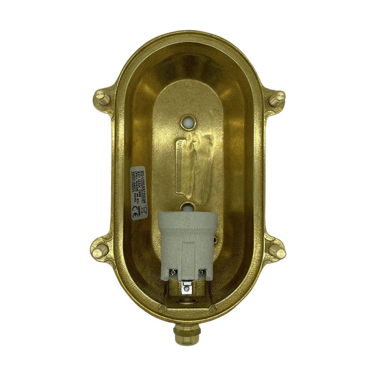 Interior view of the Small Siren oval bulkhead light in raw brass, showing the E27 ceramic lamp holder, mounting screws and cable gland, on a white background.