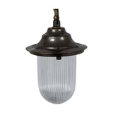 Hull Outdoor Pendant Light IP54 in antique brass, with a flared hood over a clear ribbed glass shade, hung from a chain, shown on a white background.