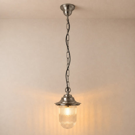 Hull Outdoor Pendant Light IP54 in satin nickel, a single-light lantern with ribbed glass shade and flat hood, hung on chain from a round ceiling cup against a plain light background.