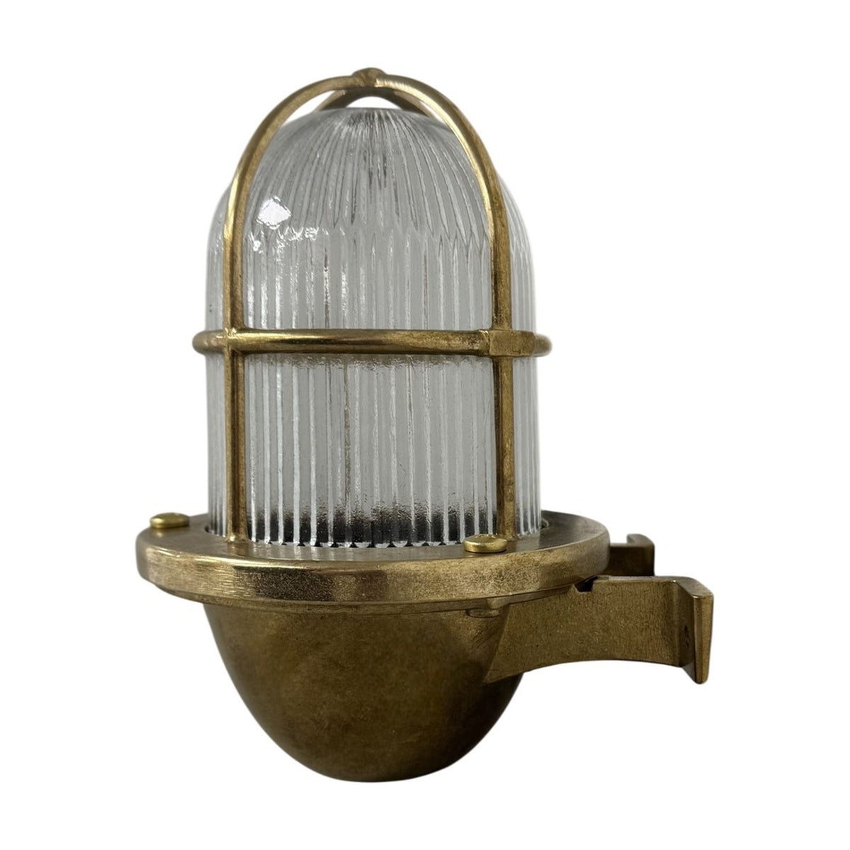Armada Uplight Outdoor Wall Lantern in raw brass, with ribbed glass dome and brass cage guard on a curved wall bracket, shown on a plain white background.