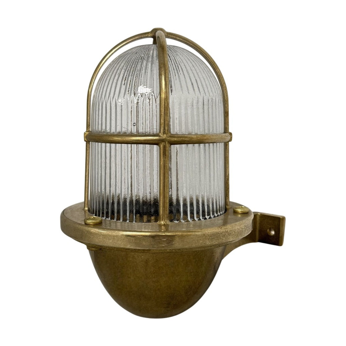 Armada Outdoor Wall Lantern in raw brass, with ribbed glass dome, brass cage guard, and wall bracket, shown on a plain white background.