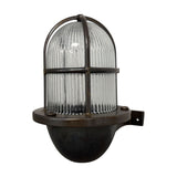 Armada Uplight Outdoor Wall Lantern in antique brass, with a ribbed glass dome and brass cage guard on a short wall bracket, IP64 rated, shown on a plain white background.