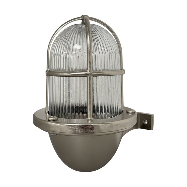 Armada Outdoor Wall Lantern in satin nickel, a caged uplight with ribbed glass dome, brass frame and rounded base, shown on a plain white background.