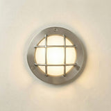 Marina Guard Circular Bulkhead Light IP64 in satin nickel, a round brass wall fixture with a grid guard over frosted glass, lit against a plain light background.