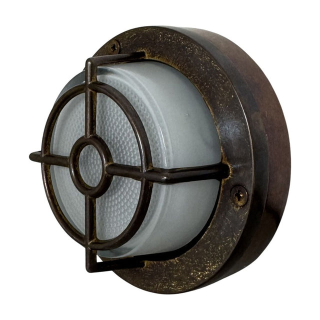 Round Walkway Guard outdoor wall light in antique brass with cross-and-ring cage guard over frosted glass diffuser, IP65 rated, shown on a plain white background.