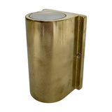 Pharos compact outdoor up and down wall light, solid raw brass half-cylinder body with flat back plate and visible mounting screw, shown on a plain white background.