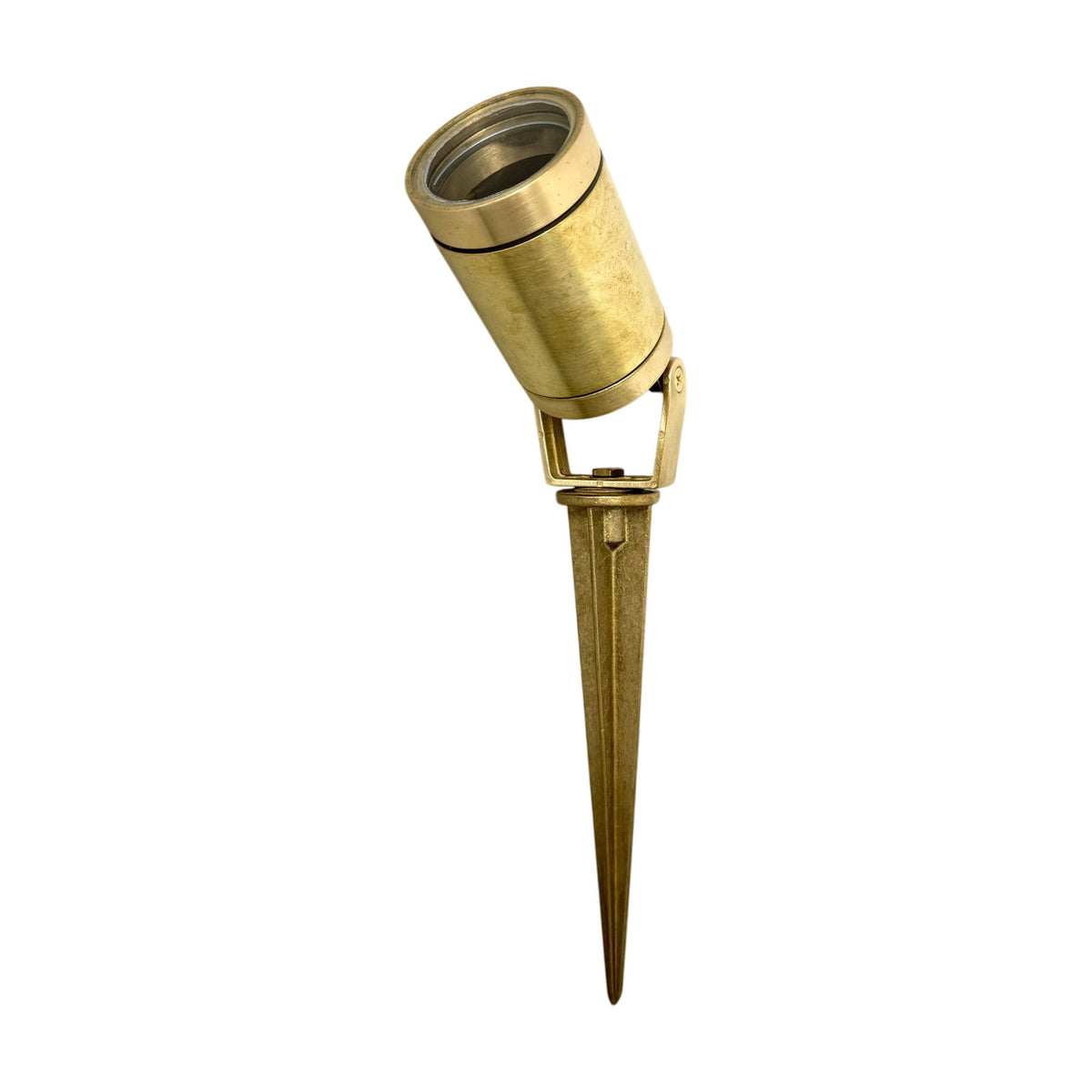 Marlinspike Garden Spike Light IP64 in Raw Brass, a cylindrical adjustable head on a tilting yoke bracket above a tapering ground spike, shown on a plain white background.