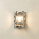 Cargo Outdoor Wall Light IP64 in mirror nickel, a brass bulkhead-style fixture with ribbed glass lens and metal guard bands, lit against a plain light background.