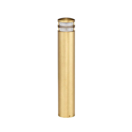 The Newbrighton 1 Light Bollard features a tall, cylindrical design with a brushed brass finish and a small, rounded top. This elegant fixture is perfect for illuminating pathways or gardens.