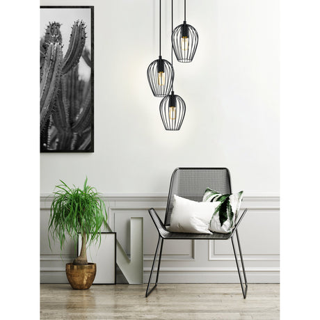 Newtown 3 Light Pendant in black steel with three tapered wire cage shades at staggered heights, shown above a wire-frame chair in a living room setting.