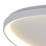 Close-up of the Mantra Niseko flush ceiling light showing its white powder-coated metal frame and illuminated inner LED band with warm white glow.