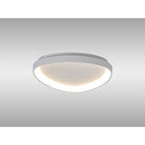 Mantra Niseko triangular flush ceiling light with integrated LED inner band and white powder-coated metal frame, shown mounted on a plain ceiling.