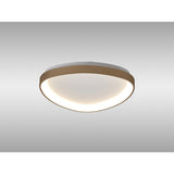 Mantra Niseko triangular flush ceiling light with gold frame and opal diffuser, mounted to a plain ceiling, shown from a low angle.
