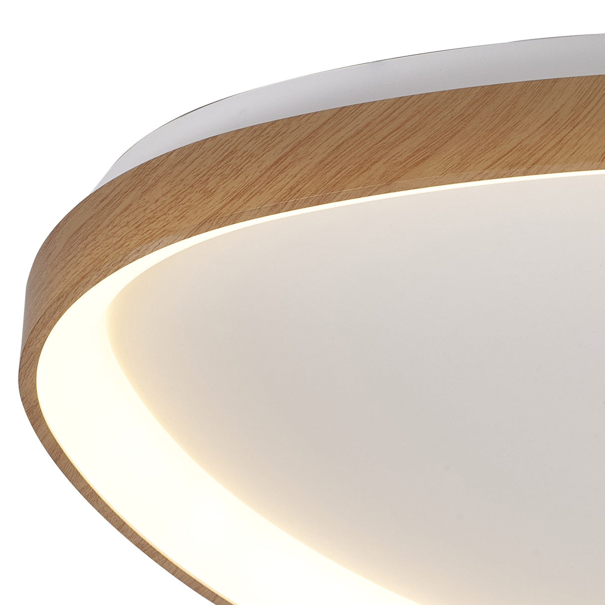 Close-up of the Mantra Niseko triangular LED flush ceiling light showing the light brown wood-effect rim and white acrylic diffuser with warm halo glow.