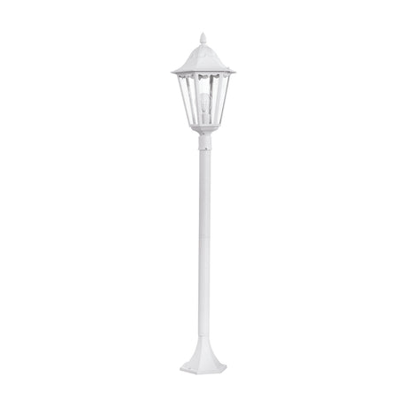 Nolmane Bollard Light in white, a tall lantern-style post light with a six-sided glass-paned head, cast aluminium column, and flared base, shown on a plain white background.