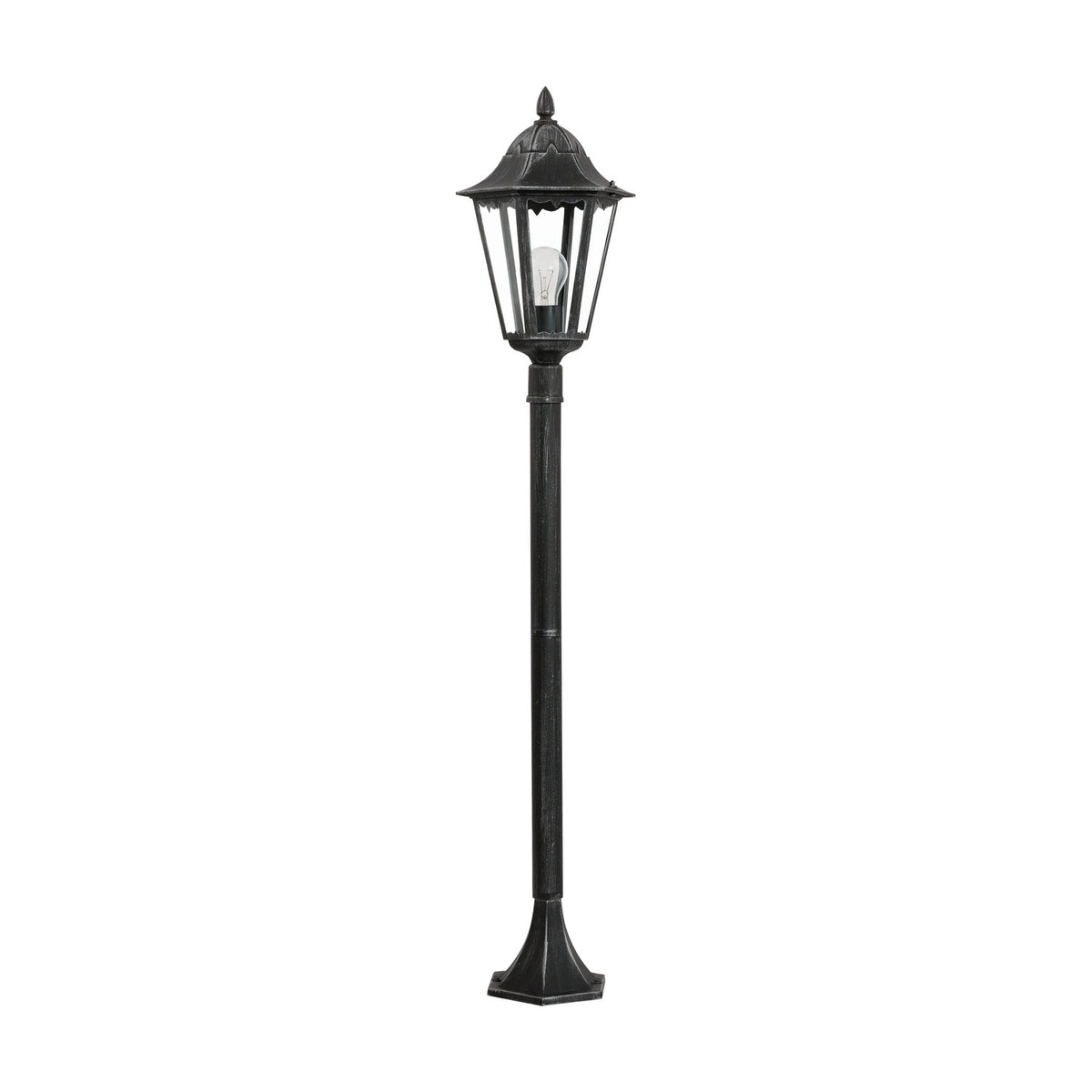 Nolmane outdoor floor lamp with a hexagonal glass-panelled lantern head, pointed finial, and slim post on a flared base, in black cast aluminium with silver patina, shown on a plain white background.