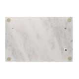 Rectangular white marble tray with soft grey veining, shown underside up with visible gold-coloured metal corner fittings and screws, on a plain white background.