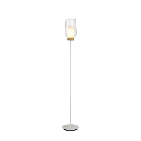 The Nora 1 Light Clear Glass Floor Lamp features a slim white stand, round base, and clear glass shade with a wooden accent. The glowing bulb adds Scandinavian style to any space. Shown on a plain white background.